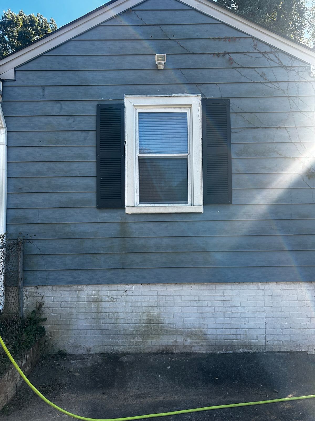 The same siding before washing