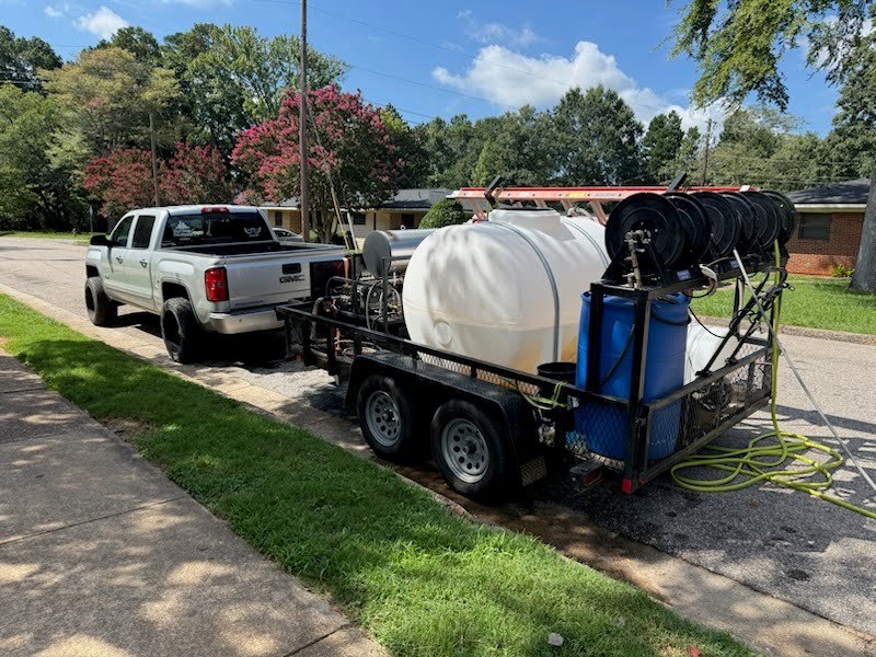 The High Society truck, trailer, water tank and hose reels that show up at every job